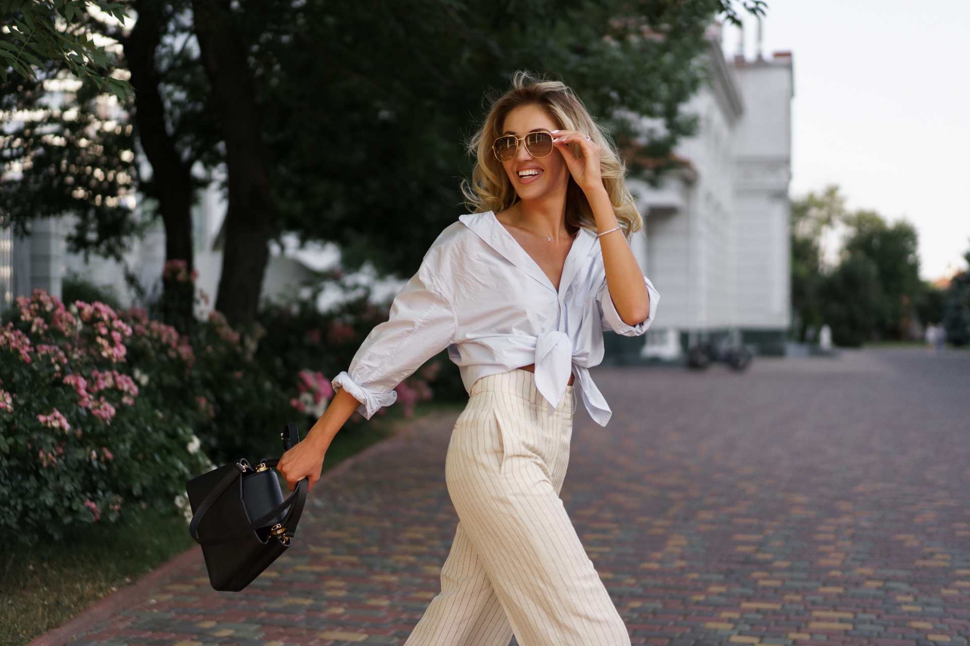 Model in a pleated silk dress in soft daylight